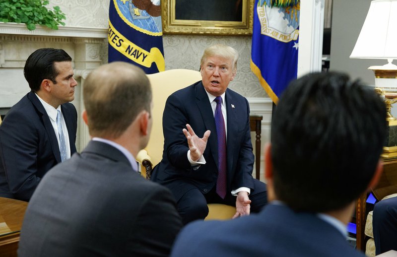 President Donald Trump speaks during a meeting with Governor Ricardo Rossello of Puerto Rico in the Oval Office of the White House on Thursday, Oct. 19, 2017, in Washington. 