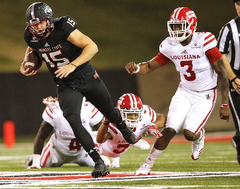 Arkansas State quarterback Justice Hansen (above) had another career night as the Red Wolves defeated Louisiana-Lafayette 47-3 Thursday night at Centennial Bank Stadium. Hansen rushed 13 times for a career-high 121 yards and 1 touchdown and passed for 275 yards and 2 touchdowns as the Red Wolves recorded their largest margin of victory over a Sun Belt Conference opponent since 2012.