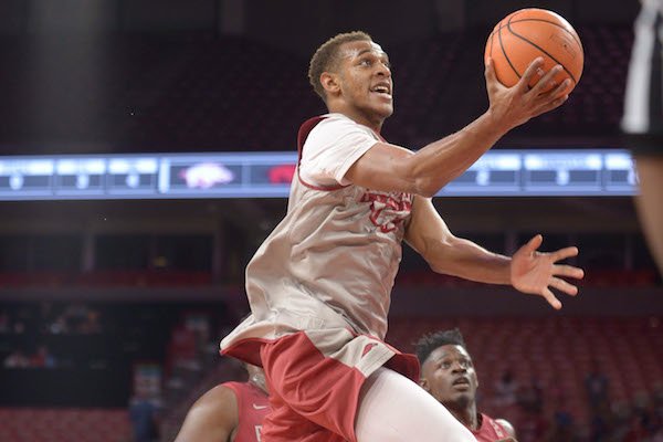 Arkansas forward Daniel Gafford reaches to score in the lane Friday, Oct. 20, 2017, during the first half of play in Bud Walton Arena. Visit nwadg.com/photos to see more photographs from the game. 
