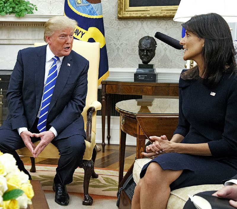 President Donald Trump talks Friday at the White House with United Nations Ambassador Nikki Haley during a meeting with U.N. Secretary-General Antonio Guterres.