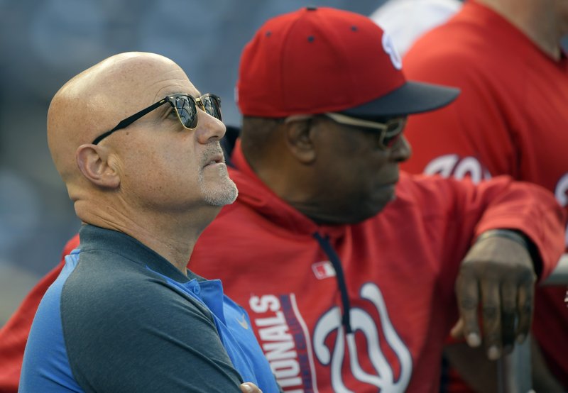 Nationals GM Mike Rizzo, left, and Manager Dusty Baker before a game in late September. 