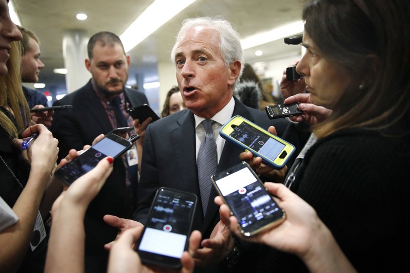 Sen. Bob Corker, R-Tenn., speaks to reporters while heading to vote on budget amendments, Thursday, Oct. 19, 2017, in Washington.