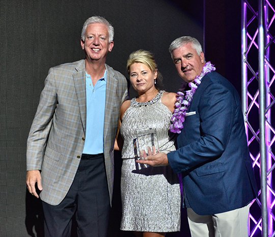 Submitted photo WONDER WALL: Donya Catlett-Vise, center, who is working to create Ali's Wonderland in Hot Springs in honor of her daughter, was honored recently at the Free to Soar fundraiser gala in San Antonio by Gordon Hartman, left, co-founder of Morgan's Wonderland, and Ron Morander, right, general manager of the park. Catlett-Vise was added to the park's Wall of Fame.