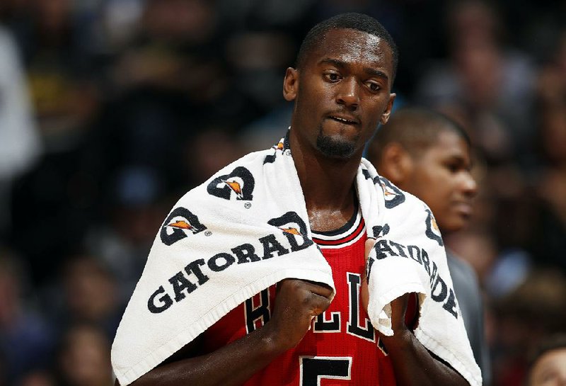 In this Nov. 22, 2016, file photo, Chicago Bulls forward Bobby Portis (5) looks on during the the second half of an NBA basketball game against the Denver Nuggets in Denver. 