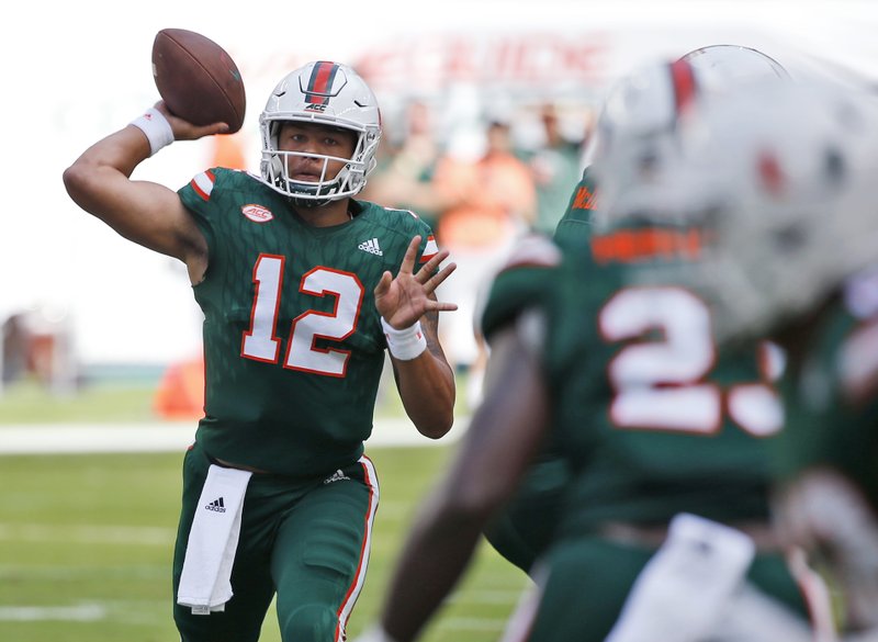 Miami quarterback Malik Rosier (12) throws a pass during the first half of an NCAA College football game against Syracuse, Saturday, Oct. 21, 2017 in Miami Gardens, Fla. (AP Photo/Wilfredo Lee)