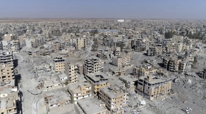 This Thursday, Oct. 19, 2017 frame grab made from drone video shows damaged buildings in Raqqa, Syria, two days after Syrian Democratic Forces said that military operations to oust the Islamic State group have ended and that their fighters have taken full control of the city. 