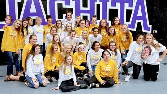 Submitted photo The Lake Hamilton Junior High volleyball team recently attended Ouachita Baptist University volleyball match. Lake Hamilton alum Kori Bullard, back, stars for the Tigers and met with the team.