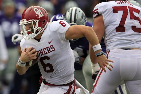 Oklahoma quarterback Baker Mayfield (6) breaks away for a 34-yard run during the first half of an NCAA college football game against Kansas State in Manhattan, Kan., Saturday, Oct. 21, 2017. (AP Photo/Orlin Wagner)