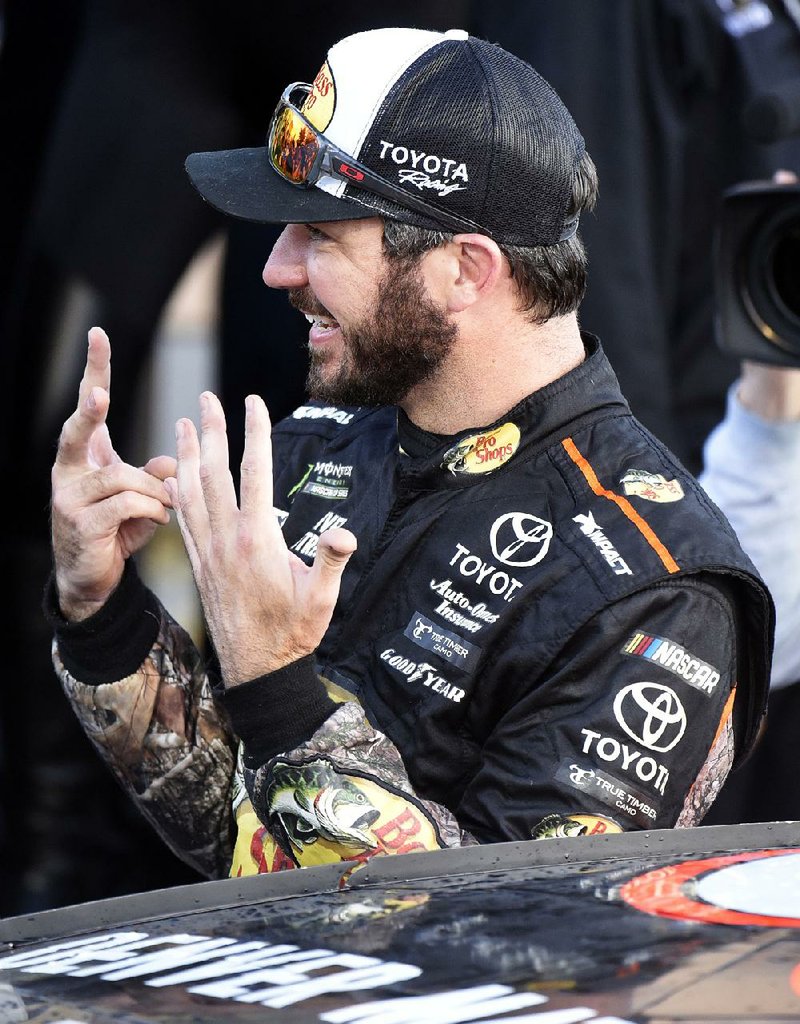 Martin Truex Jr. shows the number of races he’s won this season as he celebrates his seventh NASCAR Monster Energy Cup Series victory of the season on Sunday in Kansas City, Kan. Truex leads the points standings entering the third playoff round.






