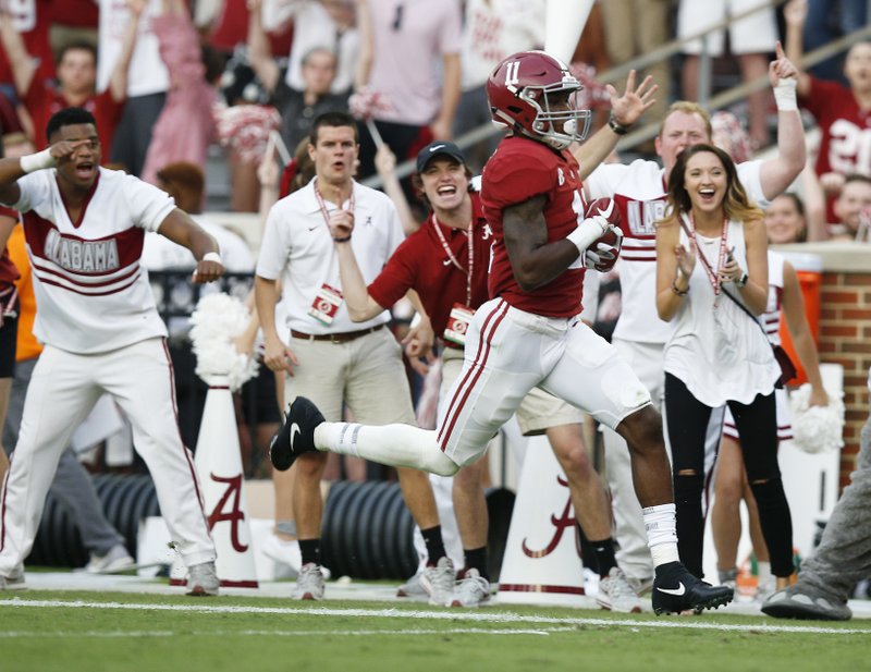 Alabama wide receiver Henry Ruggs III scores a touchdown during the second half an NCAA college football game against Tennessee, Saturday, Oct. 21, 2017, in Tuscaloosa, Ala. 