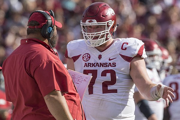 Arkansas offensive lineman Frank Ragnow talks with offensive line coach Kurt Anderson during a game against South Carolina on Saturday, Oct. 7, 2017, in Columbia, S.C.