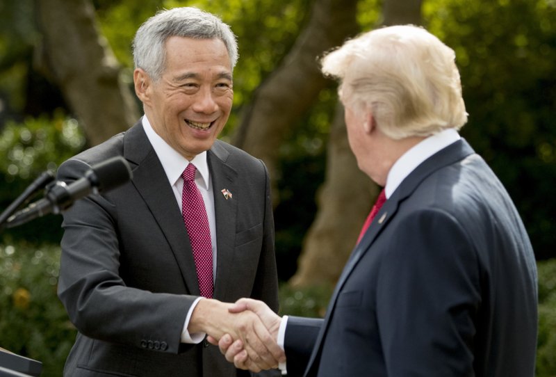 President Donald Trump and Singapore's Prime Minister Lee Hsien shake hands together following a joint statement in the Rose Garden at the White House, Monday, Oct. 23, 2017 in Washington. 