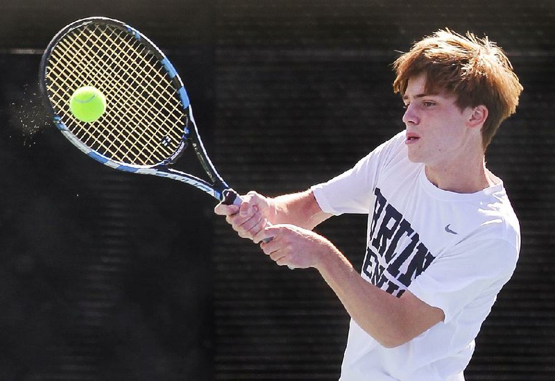 Foster Rogers of Pulaski Academy hits a volley shot Tuesday during his 7-6, 6-2 victory over Parker Stearns of Little Rock Catholic in the Overall boys state tennis tournament at Burns Park Tennis Center in North Little Rock.