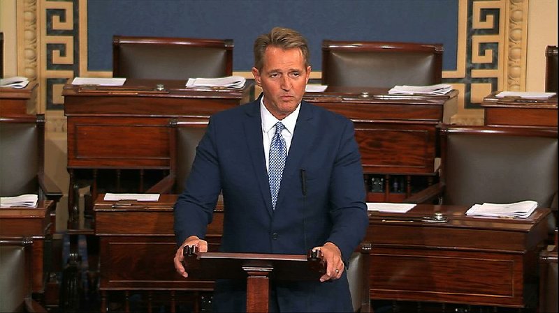 Sen. Jeff Flake, R-Ariz., delivers a speech Tuesday on the floor of the Senate in which he spoke out against President Donald Trump and announced that he would retire at the end of his term. “We were not made great as a country by indulging in or even exalting our worst impulses, turning against ourselves, glorifying in the things that divide us and calling fake things true and true things fake,” he said, to applause from members of both parties.