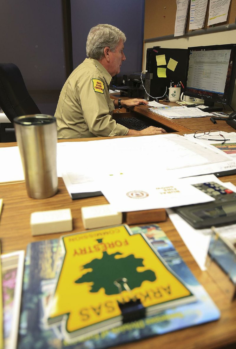 Don McBride, assistant state forester, works Tuesday afternoon in his office at 1 Natural Resources Drive in Little Rock, the new location for the Arkansas Forestry Commission.
