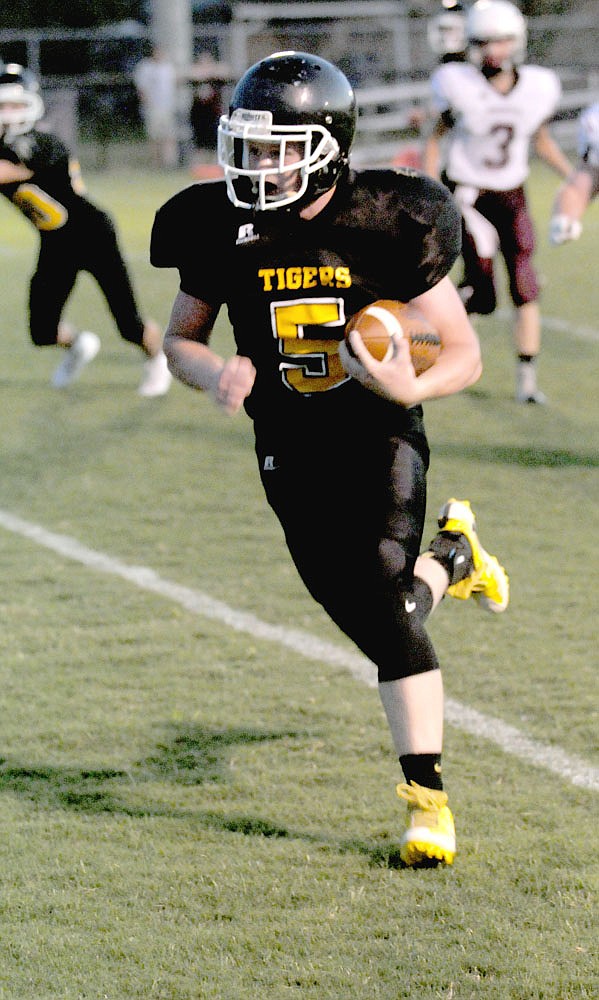 MARK HUMPHREY ENTERPRISE-LEADER Prairie Grove freshman halfback Cade Grant scored a trio of first half touchdown runs of 55 and 44 yards and this 4-yard burst to the left pylon in junior high football action against Huntsville on Thursday, Sept. 21. Grant finished with 307 yards rushing on 10 carries and 5 touchdowns.