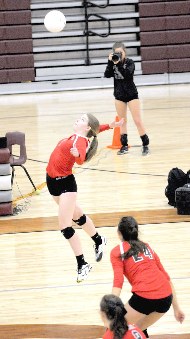 Pea Ridge junior Madison Mcguire soars to launch an aerial attack during a District 4A-1 volleyball semifinal match with Shiloh Christian Tuesday, Oct. 17. Pea Ridge won the first set, 25-22, but lost the match 3-1. The Lady Blackhawks placed third in the tournament held at Lincoln last week.