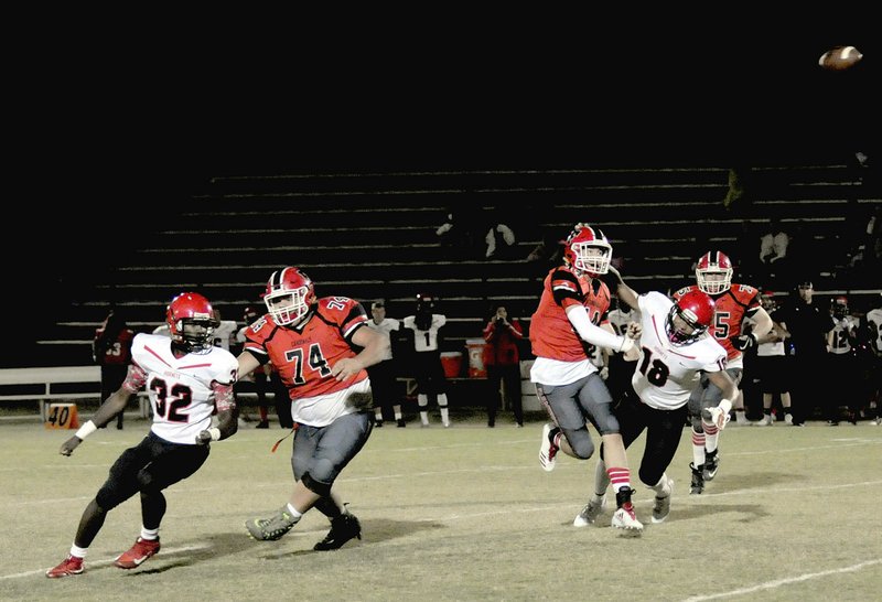 MARK HUMPHREY ENTERPRISE-LEADER Farmington senior quarterback Trey Waggle steps up in the pocket and throws. Waggle has learned how to get in between rushing lanes to make plays. He passed for a touchdown in overtime, then threw a game-winning 2-point conversion pass to lead Farmington to a thrilling, 31-30, win over Maumelle to cap his career at home Friday.