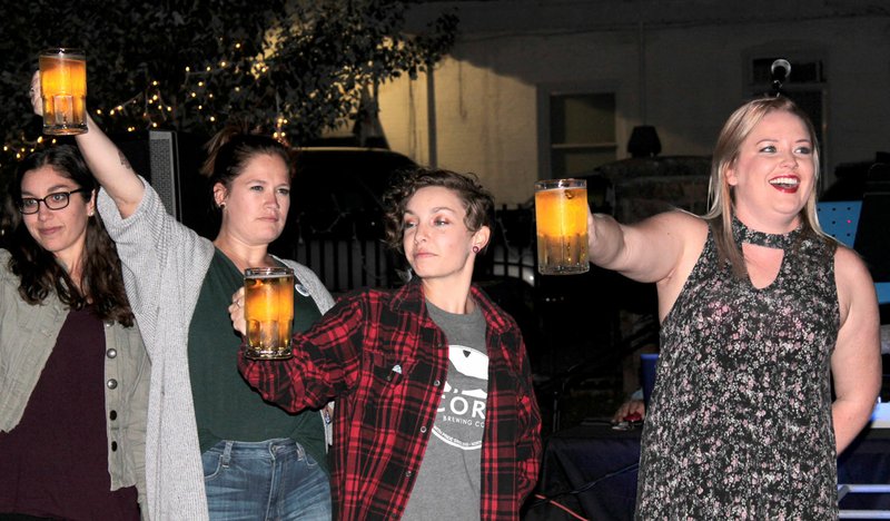 Chuck McClarty/Special to the Herald-Leader Inn at the Springs held a beer holding contest for women and men during the Tap Into History Pub Crawl on Friday evening. The event was a fundraiser for the Siloam Springs Museum.