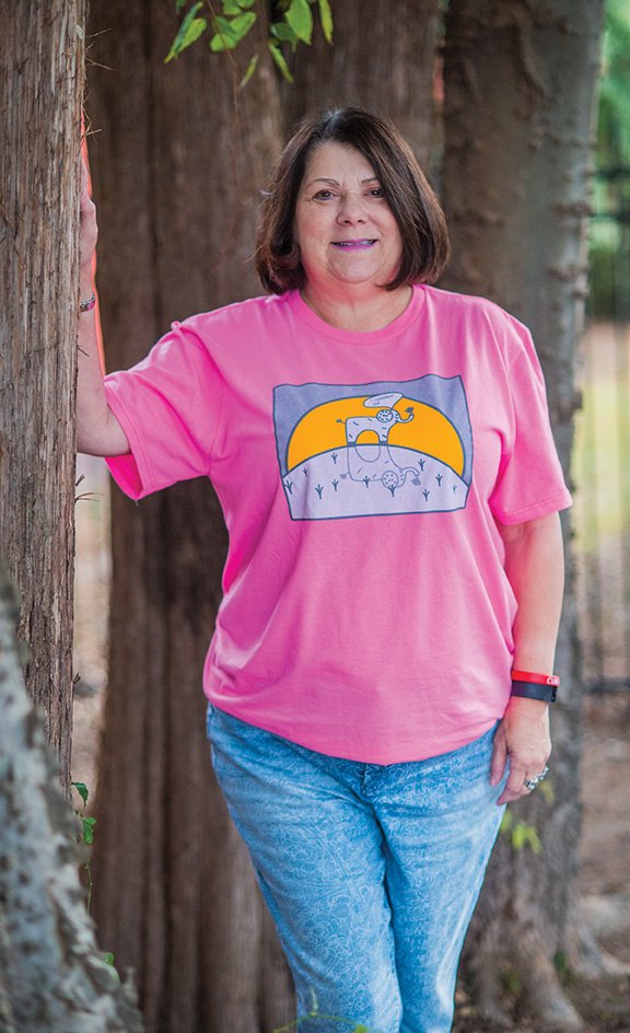 Melissa Longing wears a T-shirt to promote the Faulkner County Alzheimer’s Walk, scheduled for Saturday at Conway High School’s Buzz Bolding Arena. Free registration for the walk is at 8 a.m., and the ceremonial walk begins about 8:45. The event, which raises awareness and money for Alzheimer’s Arkansas, includes live music and a children’s costume contest.