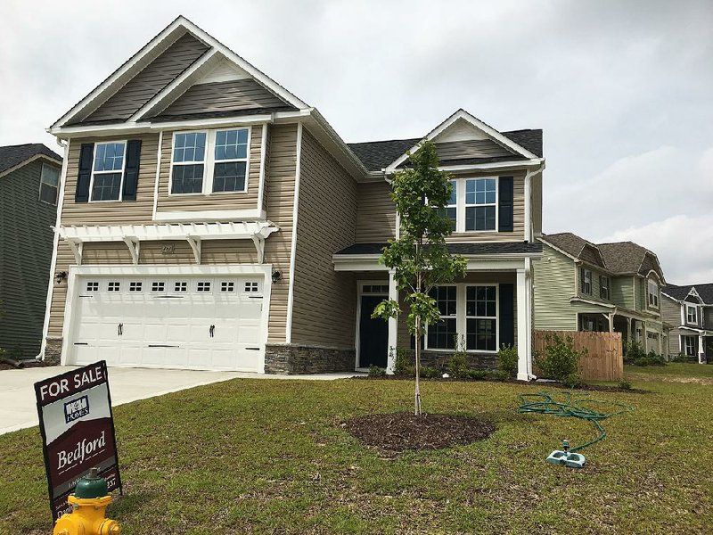 This new house was for sale last month in Raeford, N.C. New home sales jumped 18.9 percent in September to a seasonally adjusted annual rate of 667,000, the most in a decade, the Commerce Department said Wednesday. 
