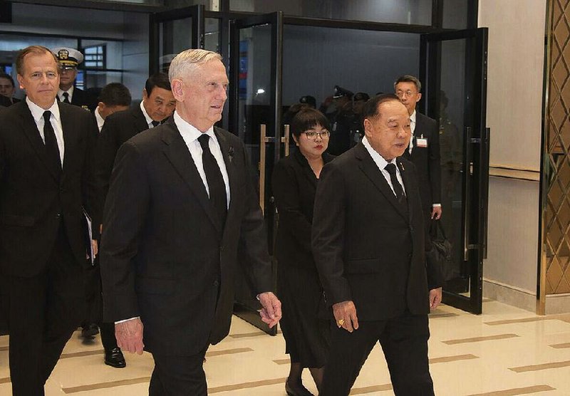 Defense Secretary James Mattis (center) arrives Wednesday with Thai Defense Minister Gen. Prawit Wongsuwan (right) for a Royal Cremation Ceremony for late Thai King Bhumibol Adulyadej in Bangkok, part of a five-day funeral after a year of mourning for the king, who died Oct. 13, 2016.