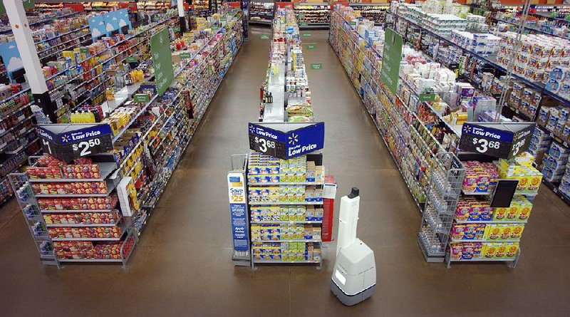 A robot prowls the aisles of a Wal-Mart store in a test run of the autonomous device’s “mission” to check shelves and alert workers to stocking or pricing needs. 
