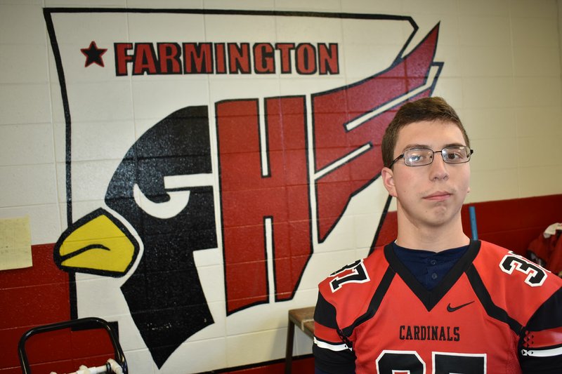 MIKE CAPSHAW/NWA DEMOCRAT-GAZETTE Farmington senior Mark Marinoni has meant far more to the team than simply being the team manager. He survived brain surgery at an early age and has been a source of motivation and inspriation for his teammates and coaches.