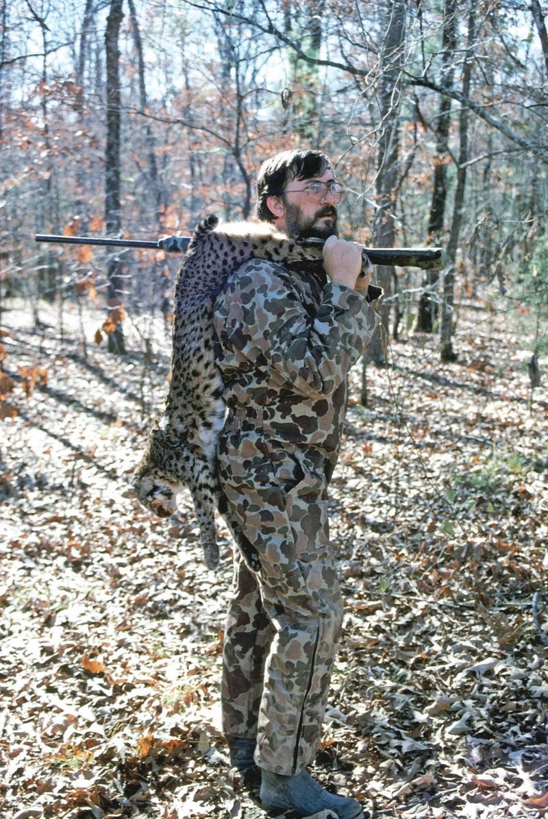 Jim Spencer of Calico Rock is shown with a bobcat he killed in Saline County. Hunting these big cats can be a very challenging endeavor.