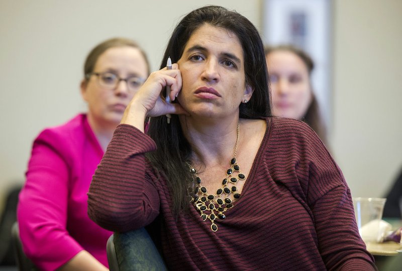 NWA Democrat-Gazette/CHARLIE KAIJO Jennifer M. Quezada, ethics case governance director at Wal-Mart, listens Thursday to speakers during a discussion featuring Northwest Arkansas business and community leaders to talk about how employers can create a safe space at work, especially for employees experiencing domestic abuse at Northwest Arkansas Community College in Bentonville.