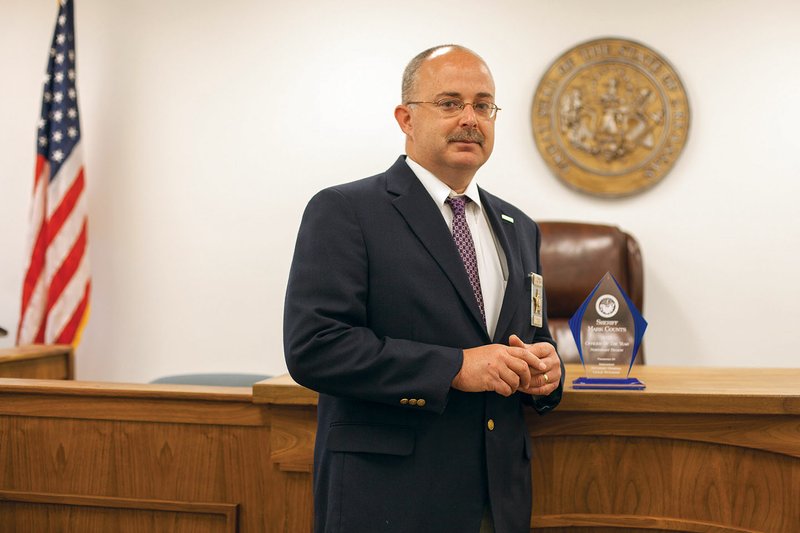 Sheriff Mark Counts stands inside the Sharp County courthouse in Ash Flat. Counts was named Regional Outstanding Law Enforcement Officer of the Year for the Northeast Region at the 15th annual Arkansas Law Enforcement Summit.