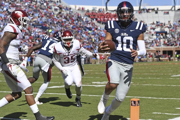 Mississippi quarterback Jordan Ta'amu (10) runs for an 8-yard touchdown run during the first half of an NCAA college football game against Arkansas in Oxford, Miss., Saturday, Oct. 28, 2017. (AP Photo/Thomas Graning)