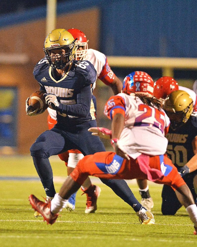 Pulaski Academy running back Mason Kolb (85) looks to avoid Little Rock McClellan defender Tyrse Lair (25) during Friday’s game in Little Rock. Pulaski Academy won 61-29.