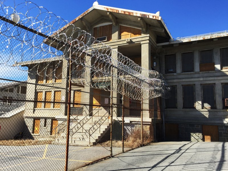 In this March 3, 2017 file photo, razor wire is coiled along a fence at the closed Mount McGregor Correctional Facility in Wilton, N.Y. Empire State Development said said Tuesday, Oct. 24, 2017 it has halted efforts to sell the former prison site for redevelopment after the three proposals that were received since the state put the site out for bid in January 2017 were rejected as unfeasible. 