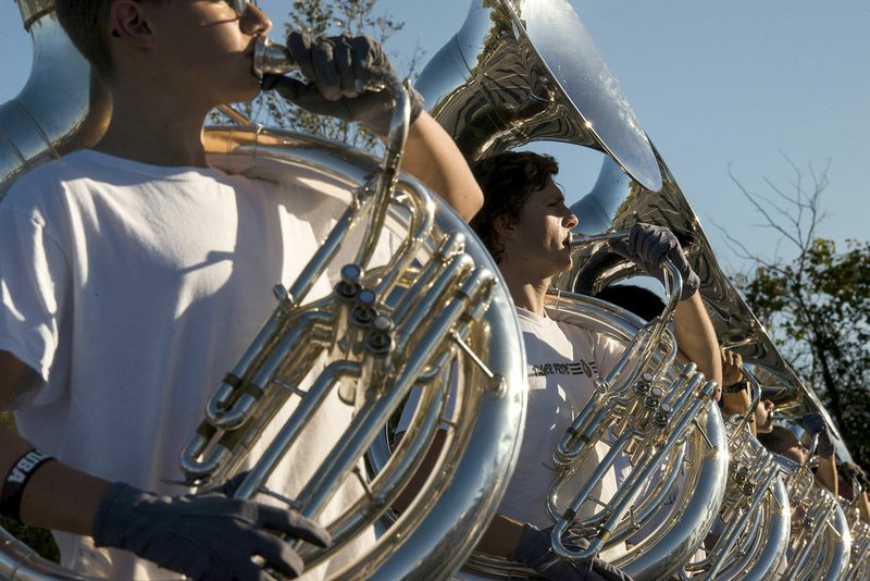 NWA Democrat-Gazette/CHARLIE KAIJO Sousaphone players practice during a marching band rehearsal Thursday at Bentonville High School. Nine Northwest Arkansas high schools will participate in the 2017 Arkansas State Marching Contest on Monday and Tuesday in Little Rock.