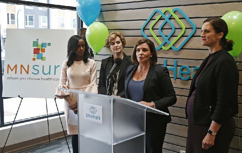 Allison O’Toole speaks to the media at the new offices of Briva Health, MNsure’s largest enrollment partner, in  Minneapolis. Health care consumers in most of the country are encountering confusion as the open enrollment period to sign up for coverage approaches.