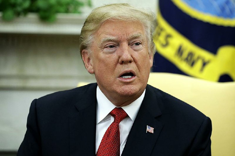 In this Monday, Oct. 23, 2017, file photo, President Donald Trump speaks during a meeting in the Oval Office of the White House in Washington. 