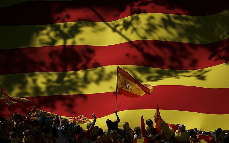 Spanish nationalists hold a rally against independence for Catalonia on Sunday in Barcelona. Hundreds of thousands of Catalans joined the protest, which took place in a festive atmosphere.