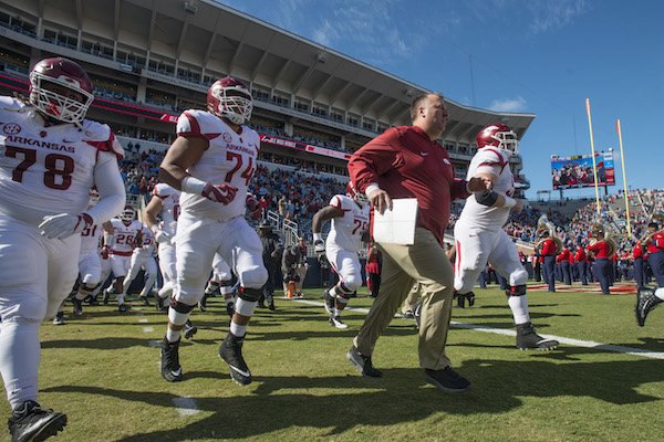 Arkansas coach Bret Bielema leads the team onto the field for the Ole Miss game Saturday, Oct. 28, 2017, at Vaught-Hemingway Stadium in Oxford, Miss. 
