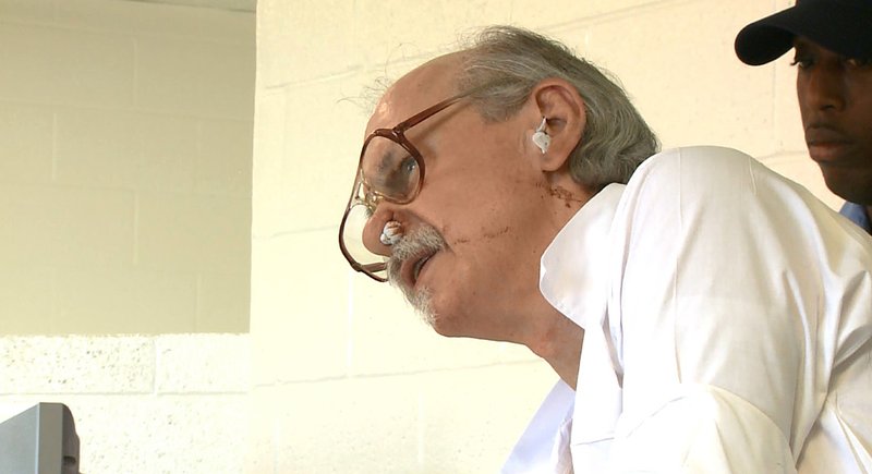 In this on Oct. 4, frame grab from video, Arkansas death row inmate Jack Greene appears before the state parole board at a prison in Varner, Ark. Greene is scheduled to die Nov. 9, but his lawyers are arguing that he is severely mentally ill and that, as a result of that, he sticks strands of tissue into his ears and nose to the point that they become bloody. (KTHV via AP, Pool)
