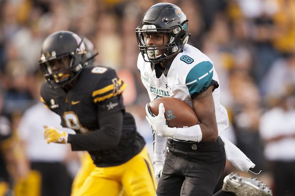 Coastal Carolina wide receiver Chris Jones gets past Appalachian State defensive back Shemar Jean-Charles after a reception in the first half of an NCAA college football game, Saturday, Oct. 21, 2017, in Boone, N.C. (Walt Unks/Winston-Salem Journal via AP)
