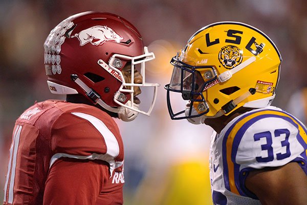 Arkansas cornerback Ryan Pulley, left, and LSU fullback Trey Gallman exchange words during the second quarter of a game Saturday, Nov. 12, 2016, in Fayetteville. LSU won 38-10.