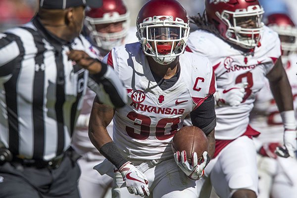 Arkansas defensive back Kevin Richardson returns a fumble for a touchdown during the fourth quarter of a game against Ole Miss on Saturday, Oct. 28, 2017, in Oxford, Miss. The Razorbacks won 38-37. 