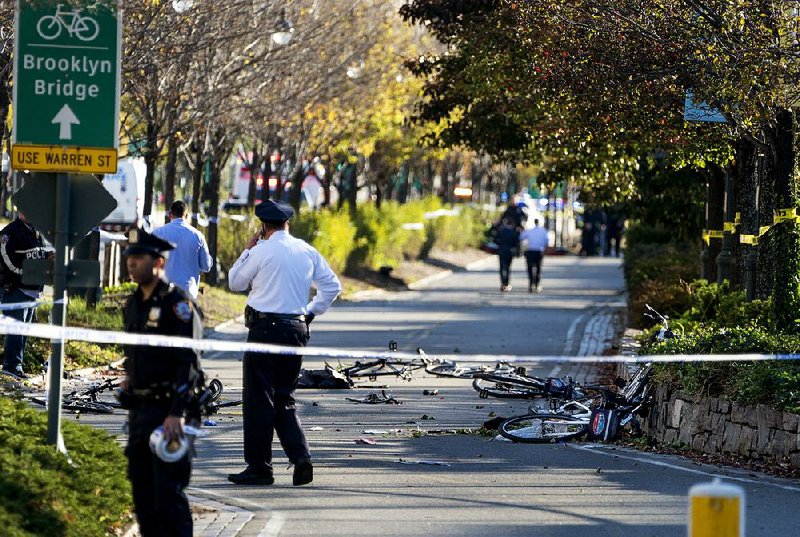 Crumpled bicycles lie on a trail near the World Trade Center Memorial after a man identified as Sayfullo Saipov reportedly drove a pickup onto the crowded path in a deadly rampage. 