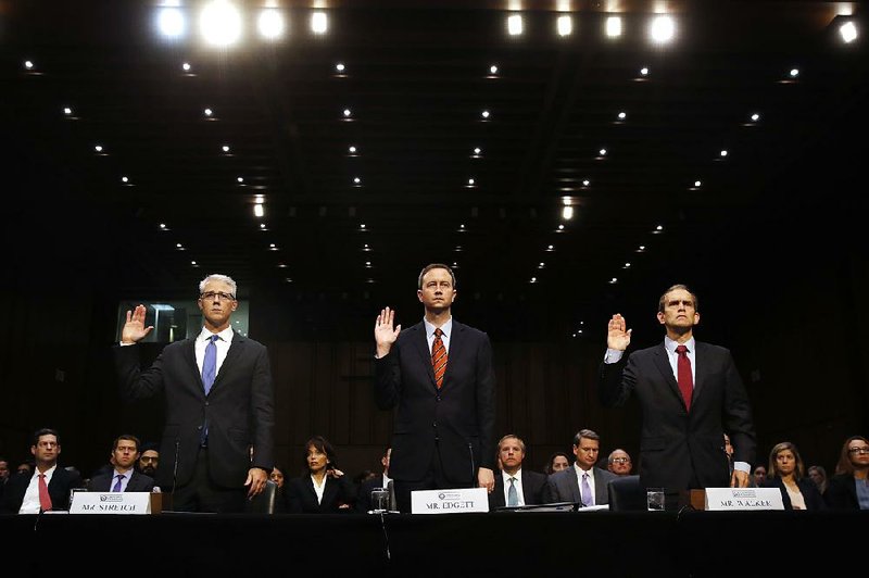 Facebook general counsel Colin Stretch (from left), Twitter acting general counsel Sean Edgett and Kent Walker, Google senior vice president and general counsel, prepare to testify Wednesday on Capitol Hill.