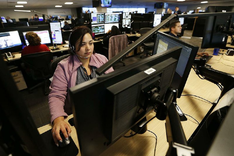 American Airlines employee Monica Mara works at the airline’s new command center at Dallas/Fort Worth International Airport last week. 