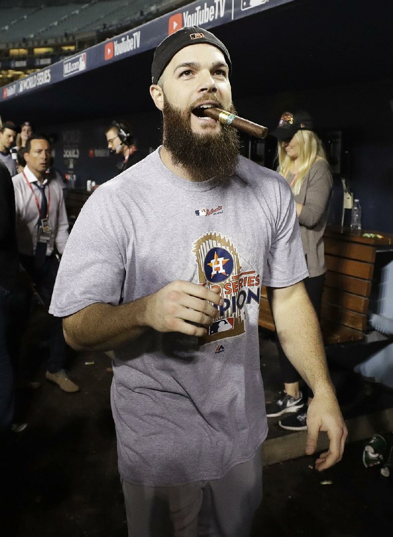 Houston Astros pitcher Dallas Keuchel (Arkansas Razorbacks) celebrates after the Astros’ 5-1 victory over the Los Angeles Dodgers in Game 7 of the World Series on Wednesday night. The victory clinched the Astros’ first title. 