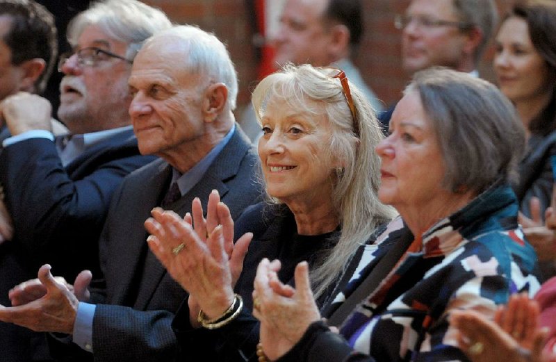 Barbara A. Tyson (center) sits between David and Barbara Pryor on Thursday during the announcement of a $1.5 million gift from Barbara A. Tyson and Tyson Foods Foundation Inc. to the David and Barbara Pryor Center for Arkansas Oral and Visual History to create the KATV Preservation Project. 