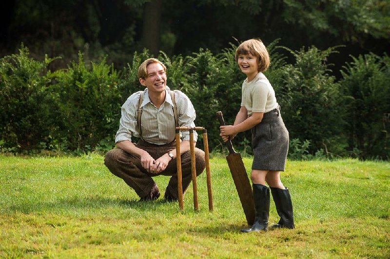 Little cricketeer Christopher Robin (Will Tilston) enjoys some rare time with his dad, writer A.A. Milne ( Domhnall Gleeson) in Goodbye Christopher Robin.