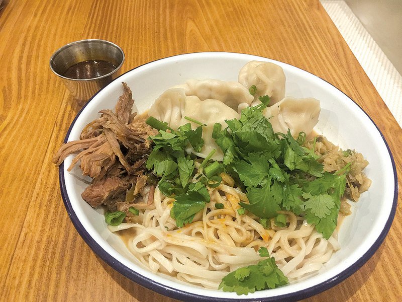 The Half + Half Bowl at Three Fold Noodles + Dumpling Co. allows diners to combine half portions of two dumpling or noodle dishes. 